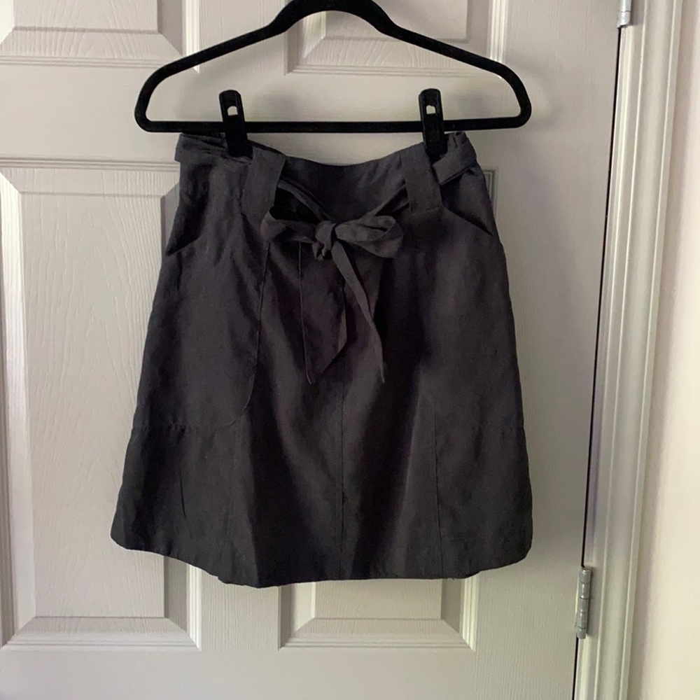 Above the knee black skirt with tie waist